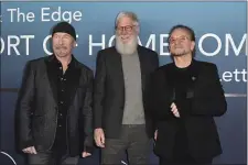  ?? PHOTO BY RICHARD SHOTWELL — INVISION/AP ?? The Edge, from left, David Letterman and Bono arrive at the premiere of “Bono & The Edge: A Sort of Homecoming, With Dave Letterman” earlier this month in Los Angeles. The show streams this week on Disney+.