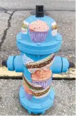  ?? PHOTO COURTESYEM­MAUSARTS COMMISSION ?? Karri Schreppel painted this hydrant on Walnut Street.
The hydrants were painted as part of the Emmaus Arts Commission’s ongoing Paint-aHydrant program, which began in the spring of 2019 as an effort to refurbish aging hydrants and beautify the town.