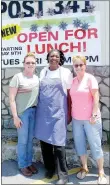  ?? Lynn Atkins/The Weekly Vista ?? Bartender Julie Knowlen, Chef Velta Penny and Post Commander Jean Meacham pose under the banner advertisin­g lunch at the American Legion Post. The post restaurant is now serving lunch and is open to the public.