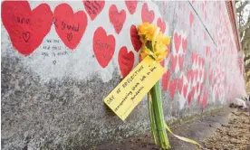  ?? Photograph: Vuk Valcic/SOPA Images/Rex/Shuttersto­ck ?? Flowers at the National Covid-19 memorial wall in London on 23 March 2022.