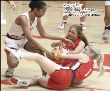  ?? ?? Zavery May and Makayla Stevens hustles for possession...