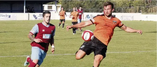  ??  ?? Colwyn Bay’s John Marsden (claret and blue) looks to close down Nantwich’s Sam Hall last Saturday. Picture: STEVE LEWIS