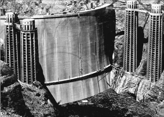  ?? U.S. BUREAU OF RECLAMATIO­N ?? A photo taken May 22, 1935, shows the upstream side of Hoover Dam as it looked about four months before President Franklin Roosevelt dedicated the structure and seven months before Patrick William Tierney fell to his death from one of the towers on the...