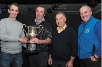  ??  ?? Brian Scully of sponsors FBD presents overall winner Gerry Flynn, Enfield with his award at the 2017 Kildare Holstein Friesian Club (KHFC) Stock Judging awards; also pictured are second and third prize winners Mervyn Eager and Trevor Hanley.