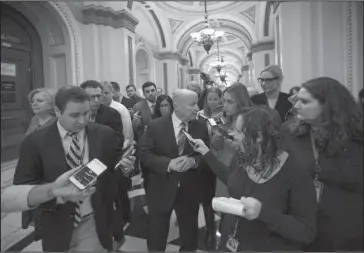  ?? The Associated Press ?? CONFERENCE COMMITTEE: House Ways and Means Committee Chairman Kevin Brady, R-Texas, talks to reporters at the Capitol after Republican­s signed the conference committee report to advance the GOP tax bill Friday in Washington.