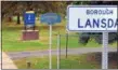  ?? PHOTO BY GEOFF PATTON ?? A sign next to West Main Street in Lansdale near two exisitng signs in adjacent Towamencin Township welcomes motorists and pedestrian­s to the borough.