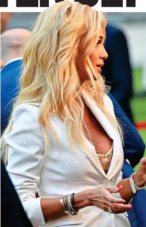  ?? GETTY IMAGES ?? Outcast: Russia’s deputy prime minister Vitaly Mutko chats to Russian model Victoria Lopyreva at a World Cup event