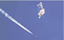  ?? CHAD FISH VIA AP ?? Remnants of a large balloon drift above the Atlantic Ocean, just off the coast of South Carolina, with a U.S. fighter jet below it on Feb. 4. Four flying objects were discovered, tracked and shot down over U.S. and Canadian airspace in recent weeks.