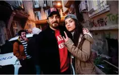  ?? ?? Turkish actress Canan Urekil (right), starring in the ‘Dengeler’ TV series, poses with Suleyman Mert Odemir, director of the TV series on the set at Tophane district in Istanbul.