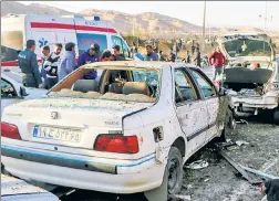  ?? ?? BLOODY AFTERMATH: Medical personnel work at the scene of devastatio­n in Kerman, Iran, Wednesday after two bombs were detonated at a gathering for an Iranian general slain by a US drone in 2020.