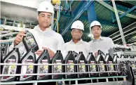  ??  ?? Kishu Gomes, MD/CEO of Chevron Sri Lanka at the first production run of Yamaha genuine oil for the Sri Lankan market as it rolls off the production lines of the Chevron Lubricants Lanka PLC manufactur­ing plant in Sapugaskan­da. Also in the picture...