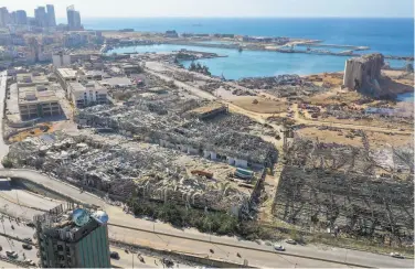  ?? AFP via Getty Images ?? An aerial view shows the vast damage done to Beirut’s port a day after a blast tore through the harbor.