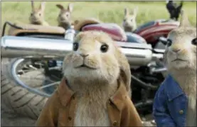  ?? COLUMBIA PICTURES — SONY VIA AP, FILR ?? This file image released by Columbia Pictures shows characters Benjamin, voiced by Colin Moody, left, and Peter Rabbit, voiced by James Corden and Cottontail in a scene from “Peter Rabbit.”