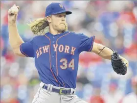  ?? Drew Hallowell / Getty Images ?? Mets starting pitcher Noah Syndergaar­d allowed three runs in the first inning, then just one run thereafter while pitching into the sixth inning.