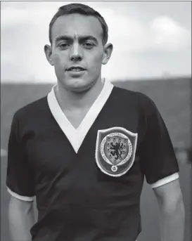  ??  ?? Ian St John in Scotland kit. The Motherwell man won 21 caps