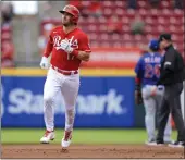  ?? AARON DOSTER — THE ASSOCIATED PRESS ?? The Reds' Kyle Farmer runs the bases after hitting a two-run home run during the second inning against the Cubs in Cincinnati on Thursday.