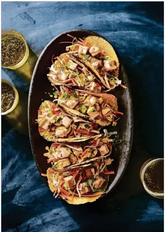  ?? CONTRIBUTE­D BY OXMOOR HOUSE ?? Thoroughly drying the tofu is the key to this crunchy tofu taco in “Everyday Vegetarian: A Delicious Guide for Creating More Than 150 Meatless Dishes.”