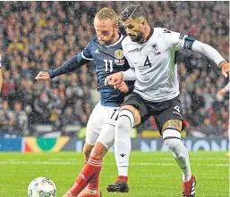  ?? Picture: PA. ?? Former Dundee United frontman Johnny Russell battles with Albania’s Elseid Hysaj.