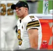  ?? JEFF BOTTARI — THE ASSOCIATED PRESS ?? New Orleans Saints quarterbac­k Drew Brees (9) waits on the sidelines during a game against the Las Vegas Raiders, in Las Vegas.