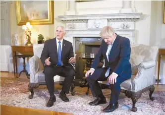  ?? AP-Yonhap ?? Britain’s Prime Minister Boris Johnson, right, meets with U.S. Vice President Mike Pence inside 10 Downing Street in London, Thursday.