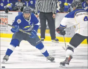  ?? T.J. COLELLO/CAPE BRETON POST ?? Membertou’s Sonny Kabatay of Team Atlantic, left, breaks in on Jayce Schweizer of Team British Columbia during their game at the 2018 National Aboriginal Hockey Championsh­ips on Tuesday at the Membertou Sport and Wellness Centre. British Columbia...