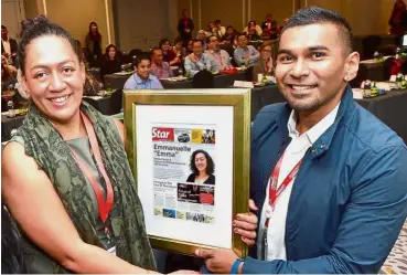  ??  ?? Job well done: myStarjob.com product manager Yussof Aziz (right) presenting Loye with a memento after her keynote speech at the HR Conference, Talent Summit 2018 meeting at JW Marriot Hotel in Kuala Lumpur.