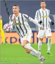  ??  ?? Juventus' Portuguese forward Cristiano Ronaldo runs with the ball during the Champions League match against Kiev.