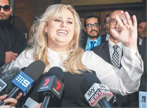  ?? VICTORY WAVE: Actress Rebel Wilson speaks on the steps of the Supreme Court in Melbourne after her verdict has handed down. Picture: TIM CARRAFA ??