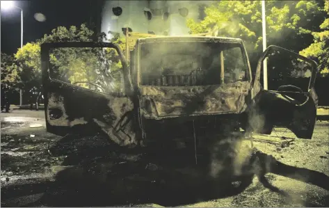  ?? AP PHOTO/LEWIS JOLY ?? Charred cars are pictured in Nanterre, outside Paris, France, on Saturday.