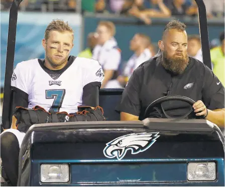  ?? MATT ROURKE/AP ?? Eagles quarterbac­k Nate Sudfeld is driven off the field after an injury during the first half of Thursday’s preseason opener.