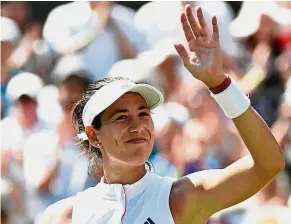  ?? — Reuters ?? Easy win: Garbine Muguruza of Spain celebrates after winning her first round match against Naomi Broady at Wimbledon yesterday.