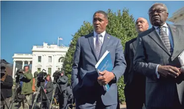  ?? ANDREW HARNIK/AP ?? From left, Rep. Cedric Richmond, D-La., the chairman of the Congressio­nal Black Caucus, Rep. André Carson, D-Ind., and Rep. Jim Clyburn, D-S.C., speak to the news media after meeting with President Trump last March.