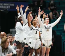 ?? POWERS IMAGERY — PAC-12 ?? Colorado guard Tameiya Sadler, center, and others on the Buffs’ bench celebrate against Oregon during the Pac-12tourname­nt on March 6 in Las Vegas.