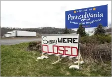  ?? CHRISTOPHE­R DOLAN — THE TIMES-TRIBUNE VIA AP ?? A sign reading “Sorry We’re Closed” is placed at the Pennsylvan­ia welcome sign on the westbound lanes of Interstate 80in Delaware Water Gap, Pa. on Saturday. The sign is a short distance from the New Jersey border greeting motorists traveling west.