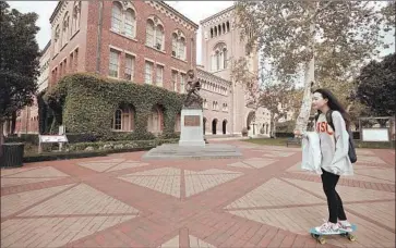  ?? AL SEIB Los Angeles Times ?? USC’S UNIVERSITY PARK campus was less crowded than usual Wednesday as the university shifted all instructio­n to online classes. “It’s an adjustment — no one has done this before,” one student said of the move.