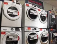  ?? THE ASSOCIATED PRESS ?? Washers and dryers are displayed for sale at a J.C. Penney store in Pittsburgh. Orders for long-lasting manufactur­ed goods posted only a modest gain in March 2017 as a key category that tracks business investment plans remained weak.