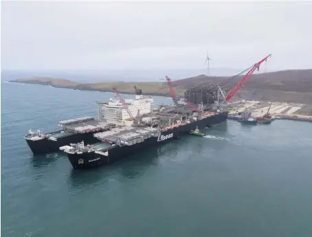  ?? ?? Ninian jacket arriving on Pioneering Spirit for decommissi­oning at Dales Voe, Lerwick.