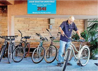  ?? [PHOTO BY JIM BECKEL, THE OKLAHOMAN] ?? Larry Batten, Chain Reaction Ministries coordinato­r, refurbishe­s bicycles at First Christian Church of Oklahoma City to give away to those who need them.