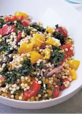  ?? MIA VIA AP ?? Israeli couscous with swiss chard and peppers is very nice served warm, but it’s also a great roomtemper­ature salad, perfect for a picnic or a potluck barbecue party.