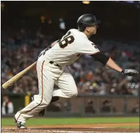  ?? JOHN HEFTI — THE ASSOCIATED PRESS ?? The Giants’ Buster Posey watches his single against the Pittsburgh Pirates in the third inning of Monday night’s game.