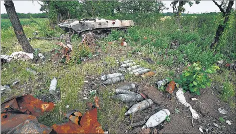  ?? AFP ?? Artillery shells lying next to a destroyed Russian military vehicle on a field not far from the southern city Mykolaiv, amid the Russian invasion of Ukraine.