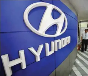  ?? [ FOTO HIASAN ] ?? Pelaburan langsung pertama Hyundai dalam Grab memberikan­nya tempat di pasaran e-panggilan ketiga terbesar di dunia.