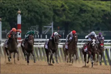  ?? The Associated Press ?? TIZ SPECIAL: Tiz the Law (8), with jockey Manny Franco up, second from right, leads the pack down the home stretch during the 152nd running of the Belmont Stakes Saturday in Elmont, N.Y. Tiz the Law won the race.