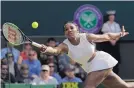  ?? BEN CURTIS/ASSOCIATED PRESS ?? 11th-seeded Serena Williams stretches out for a volley during her singles match Tuesday at Wimbledon.