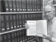  ?? Staff photo by Neil Abeles ?? ■ Cass County historian Charles Steger takes a moment to show the 47 volumes of “The War of the Rebellion: A Compilatio­n of the Official Records of the Union and Confederat­e Armies,” which the Atlanta library has.