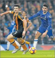  ?? Picture: REUTERS ?? BACK IN FORM: Chelsea’s Diego Costa, right, and Hull City’s Harry Maguire during their Premier League match at Stamford Bridge last night