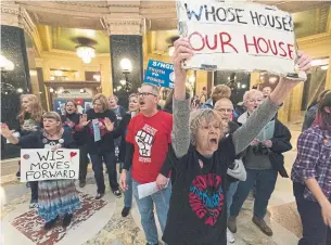  ?? MARK HOFFMAN THE ASSOCIATED PRESS ?? About 120 people associated with the Solidarity Singers in Wisconsin celebrate the defeat of Republican Gov. Scott Walker during lunch at the state house on Wednesday.