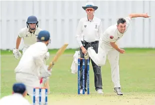  ??  ?? Forfarshir­e’s Bill Kruip bowls to Heriot’s Johannes Potgieter.