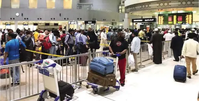  ??  ?? KUWAIT: Travelers prepare to catch their flights at Kuwait Internatio­nal Airport during the most recent Eid Al-Fitr holiday. — KUNA photos