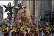  ?? JEENAH MOON — THE ASSOCIATED PRESS ?? The Tom Turkey float moves down Sixth Avenue in New York during the Macy’s Thanksgivi­ng Day Parade on Thursday.